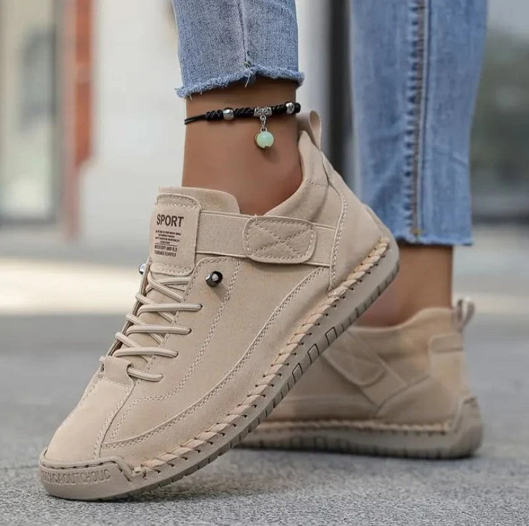 Mia Sneakers in cream, worn with frayed jeans