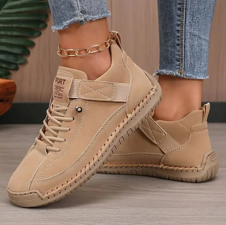 Mia Sneakers in khaki, worn with frayed jeans