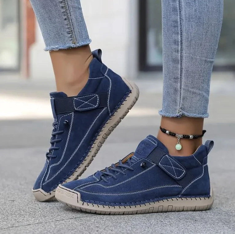 Mia Sneakers in navy, worn with frayed jeans
