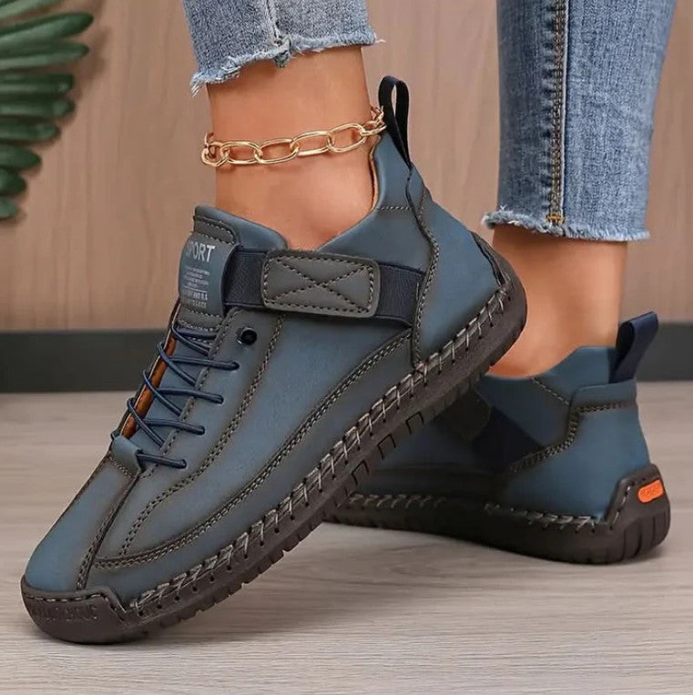 Mia Sneakers in slate blue, worn with frayed jeans