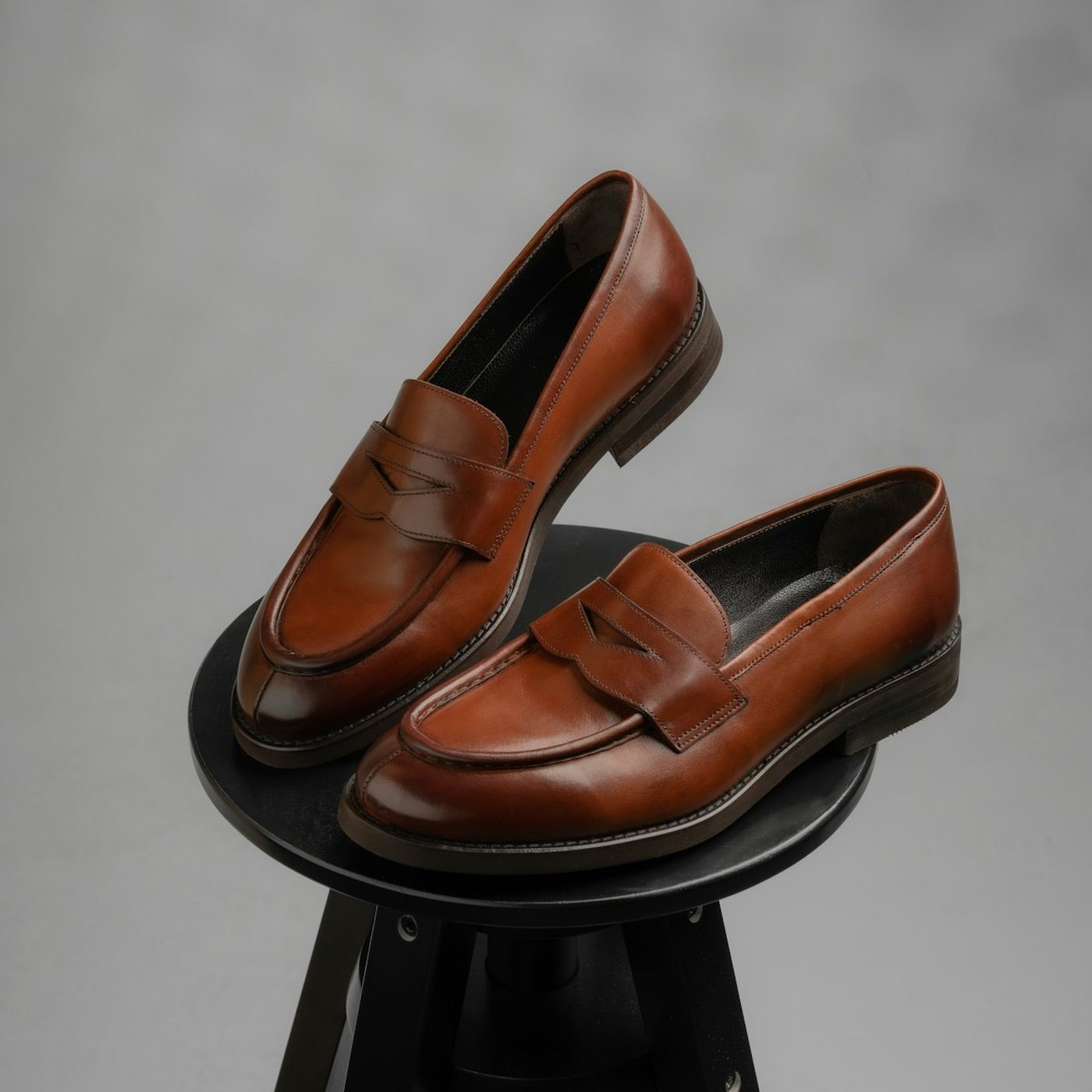 Light grey Annette loafers with a gold-tone buckle
